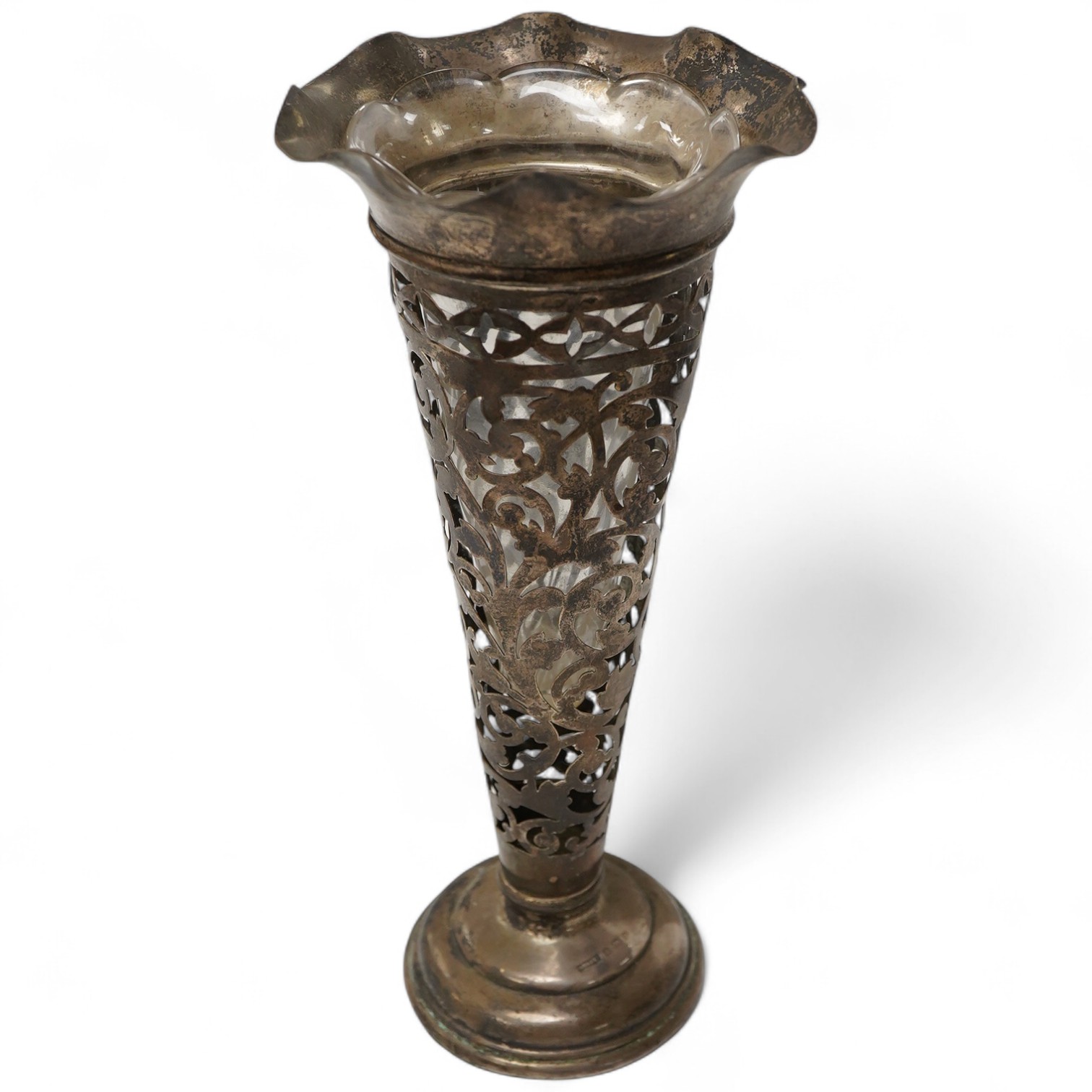 An Edwardian pierced silver trumpet shaped spill vase, by S. Blanckensee & Son Ltd, Birmingham, 1902, with glass insert, weighted, height 22.3cm.